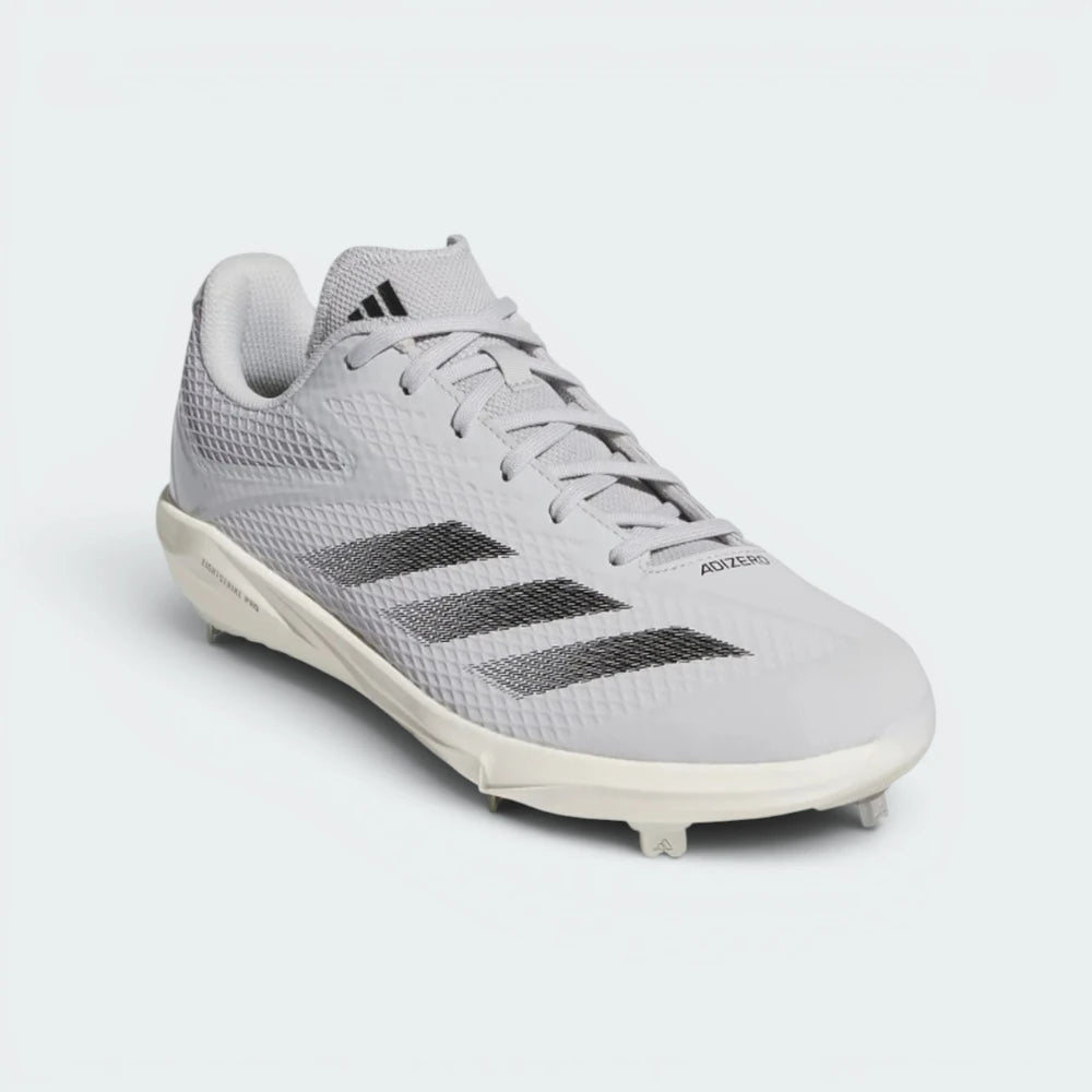 Emphasising the ultra-light, forward-leaning stance of the cleats and the sharp contrast between the light grey chassis and dark black branding.