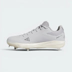 A light gray Adidas baseball cleat with white studs and a white midsole, shown in a side profile on a light gray background.