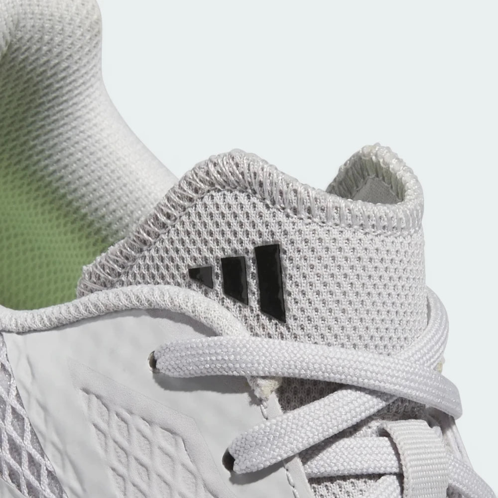 Details the precision of the synthetic drag-guard wrapping the front toe tip, showing off the clean lace tracking over the tongue.