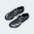 Focuses on the unique asymmetrical closure architecture and the prominent hook-and-loop lockdown strap for an unreal secure fit.
