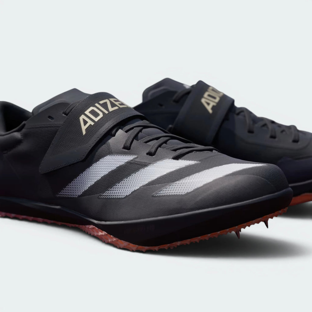 Details the texture of the hook-and-loop material and the precision alignment of the forefoot spikes.