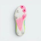 Displays the high-traction cleat arrangement on the synthetic outsole, showcasing the aggressive stud configuration engineered for unreal grip and dig on baseball clay and outfield grass.