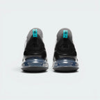 Focuses on the structured shape of the rear spine, highlighting the rigid black external heel counter designed to stabilise the foot and the prominent Air Max branding sitting above the translucent teal heel window.