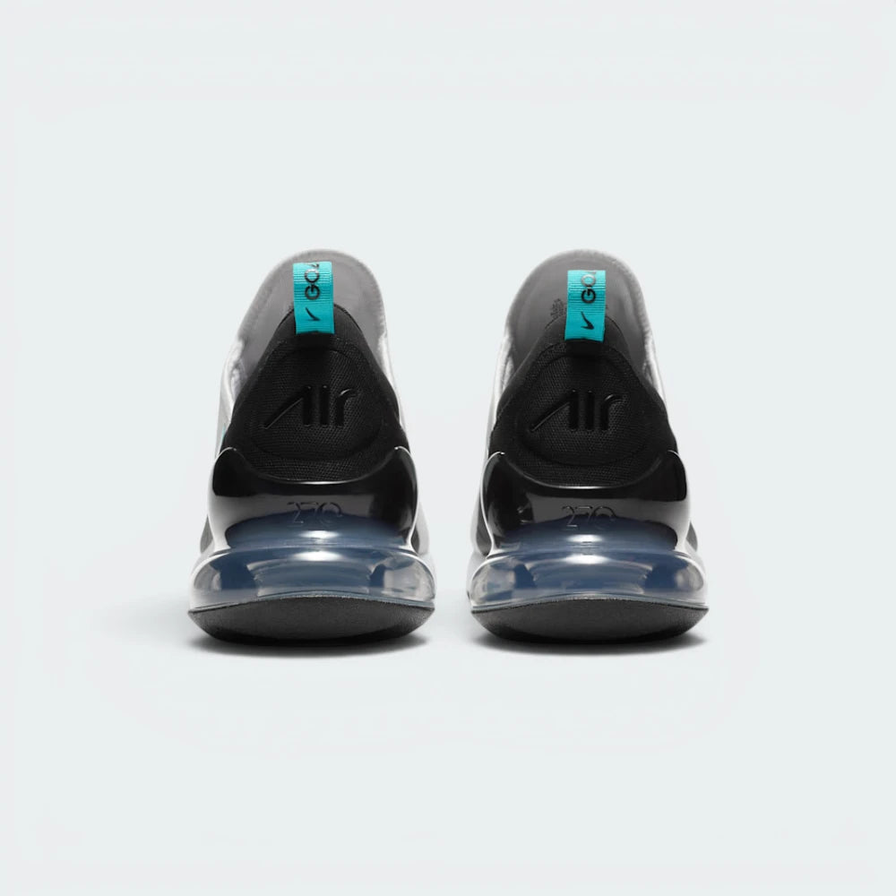 Focuses on the structured shape of the rear spine, highlighting the rigid black external heel counter designed to stabilise the foot and the prominent Air Max branding sitting above the translucent teal heel window.