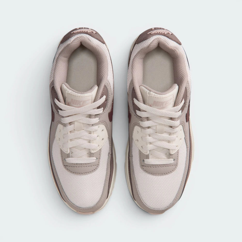Focuses on the locked-in lace closure layout, the clean Phantom mesh over the toe box, and the branded tongue patches.