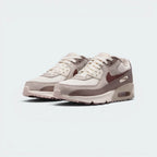 Emphasising the robust, low-top retro silhouette and the professional harmony of the earth-toned gradient panels.