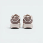 Focuses on the ribbed rubber heel badge featuring classic Nike Air branding and the clean finish of the sole casing.