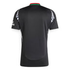 Rear-facing overhead view of the black jersey, displaying the clean unbranded back panel, curved droptail hem, and collar trim.