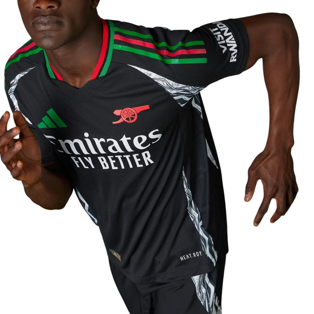 Dynamic angled shot of a model in motion wearing the jersey, emphasizing the ergonomic slim fit, shoulder 3-Stripes, and sleeve sponsor placement.