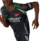 Dynamic angled shot of a model in motion wearing the jersey, emphasizing the ergonomic slim fit, shoulder 3-Stripes, and sleeve sponsor placement.