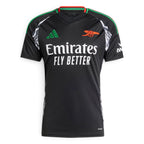 Clean overhead studio layout of the folded jersey showcasing the symmetrical chest layout, embroidered Arsenal crest, and sponsor branding.