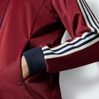 Zoom looking at the ribbed cuffs and hem, showcasing the secure, elasticated fit and the high-quality Noble Maroon finish.