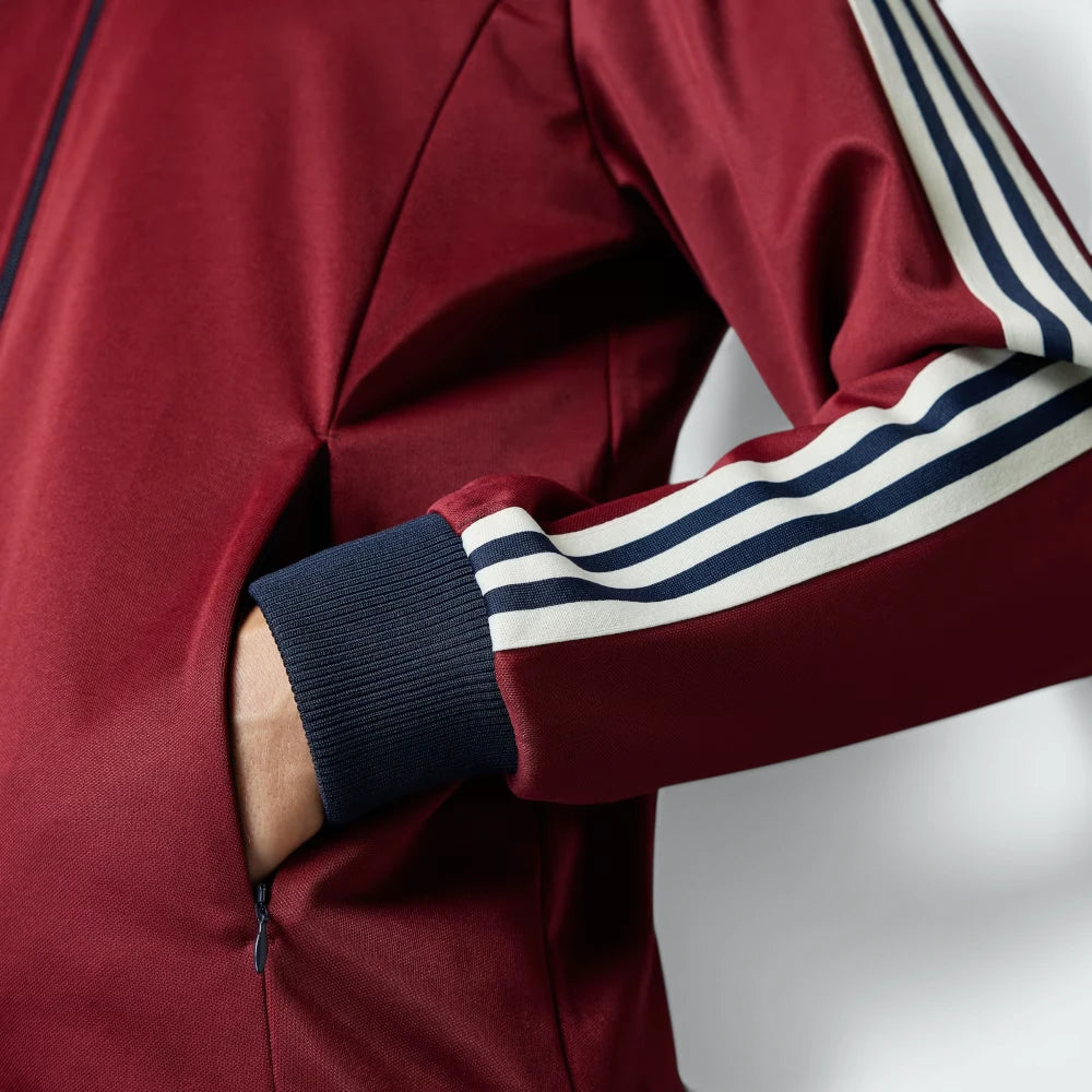 Zoom looking at the ribbed cuffs and hem, showcasing the secure, elasticated fit and the high-quality Noble Maroon finish.