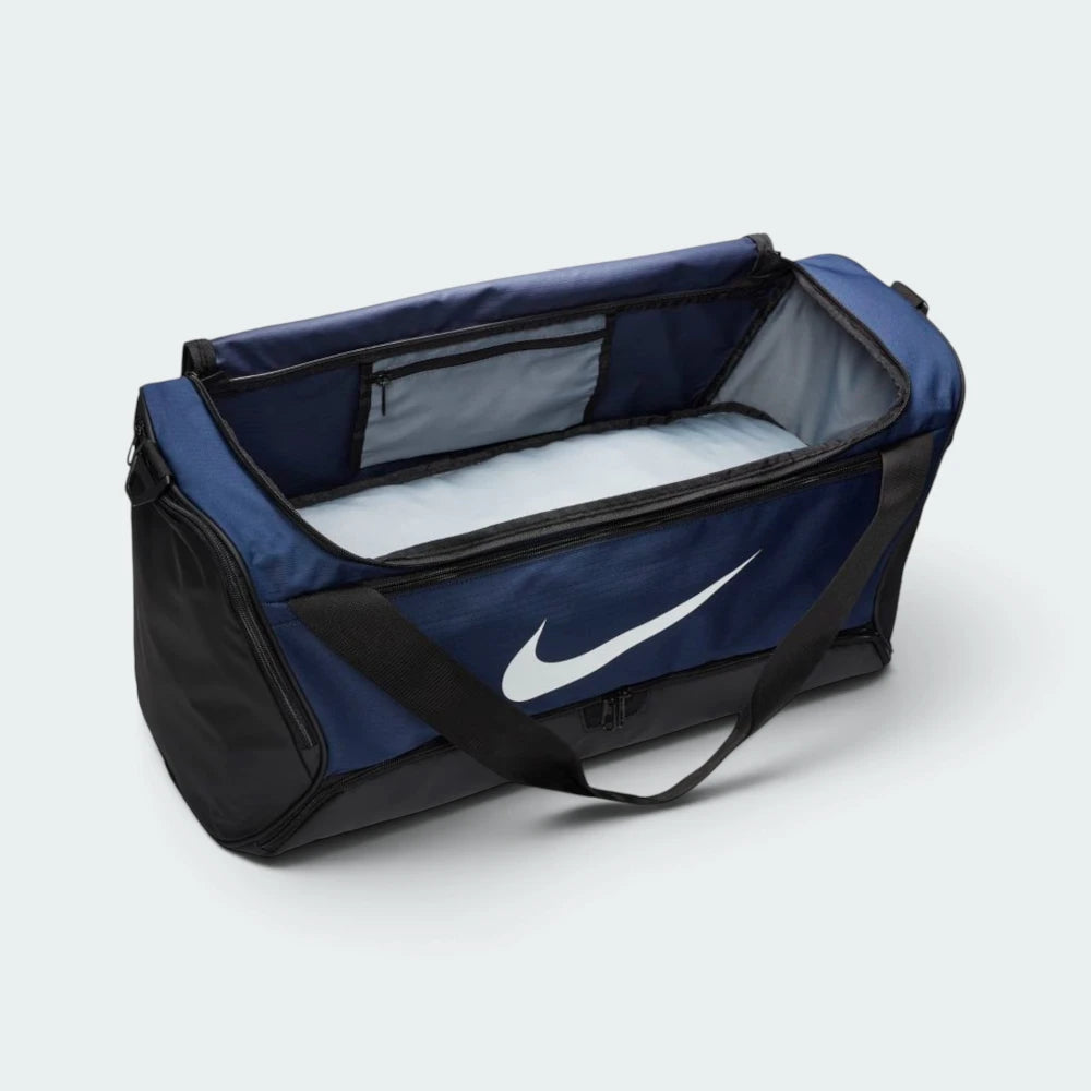 Focuses on the spacious internal storage cavity lined with light grey fabric, showing the wide U-shaped zip opening and an internal zipped hanging pocket for secure storage of small valuables.