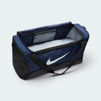 Focuses on the spacious internal storage cavity lined with light grey fabric, showing the wide U-shaped zip opening and an internal zipped hanging pocket for secure storage of small valuables.