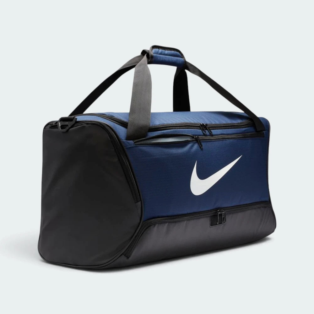 Emphasising the structured rectangular footprint of the duffel bag, displaying the front zip pocket, the prominent white Nike Swoosh, and the lower zip bottom compartment access point.