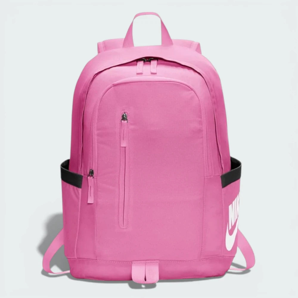 Main profile of the pink Nike All Access Soleday backpack, showing the slim construction and zippered side pocket.