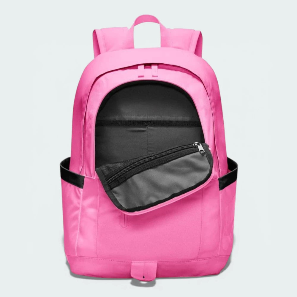 Overhead view of the backpack, showcasing the wide opening of the main compartment with dual zippers.