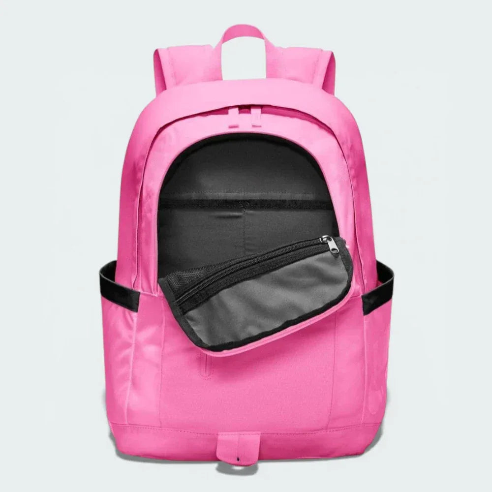 Overhead view of the backpack, showcasing the wide opening of the main compartment with dual zippers.