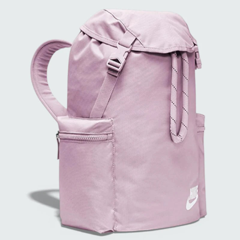 Three-quarter view of the bag cinched shut, demonstrating how the drawstrings function as comfortable shoulder straps.