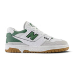 Displays the full lateral silhouette featuring the crisp white full-grain leather upper, perforated midfoot panels, Brighton Grey suede toe bumper, puffed two-tone 'N' logo with Nori green border, stitched white midsole, and rubber outsole rim.