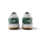 Close-up rear angle focusing on the structured white leather heel counter, Nori green suede and Green collar inserts, embroidered Flying 'NB' logo, and solid rubber cupsole base.