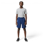 Person wearing a gray t-shirt and blue shorts on a white background