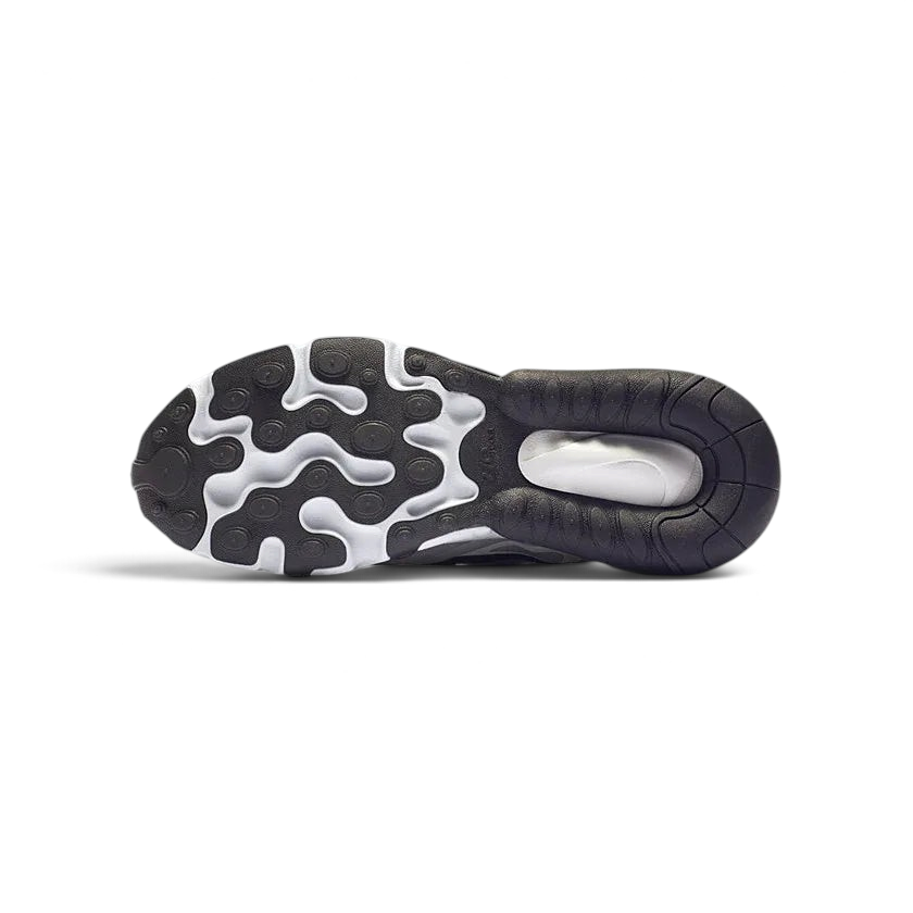 View of the outsole of the Nike Air Max 270 Juniors' white trainers, showing the durable rubber tread pattern with flex grooves.