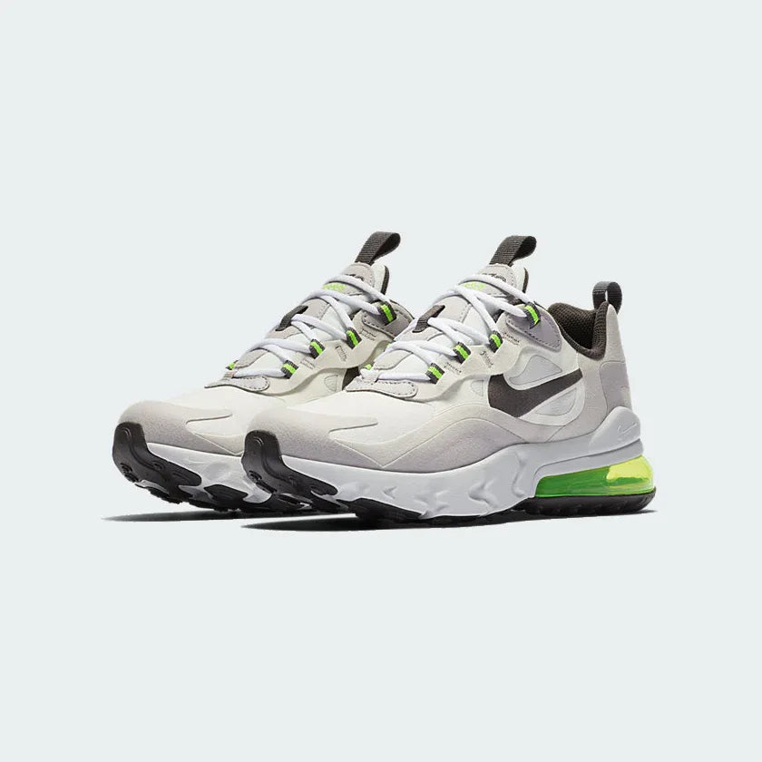 Angled view of two Nike Air Max 270 Juniors' trainers in summit white, silver, and lilac, side by side, showcasing their bold design and visible Air unit.