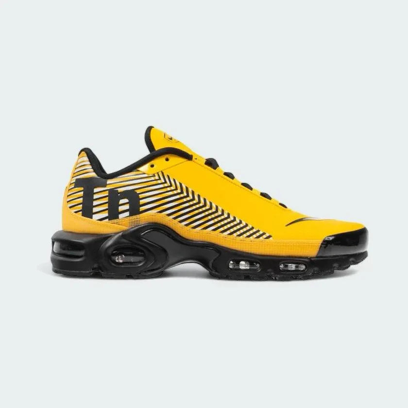 Nike Air Max Plus TN Special Edition Juniors' trainers in amarillo yellow, white, and black, side profile showing visible Tuned Air units and distinctive wavy overlays.