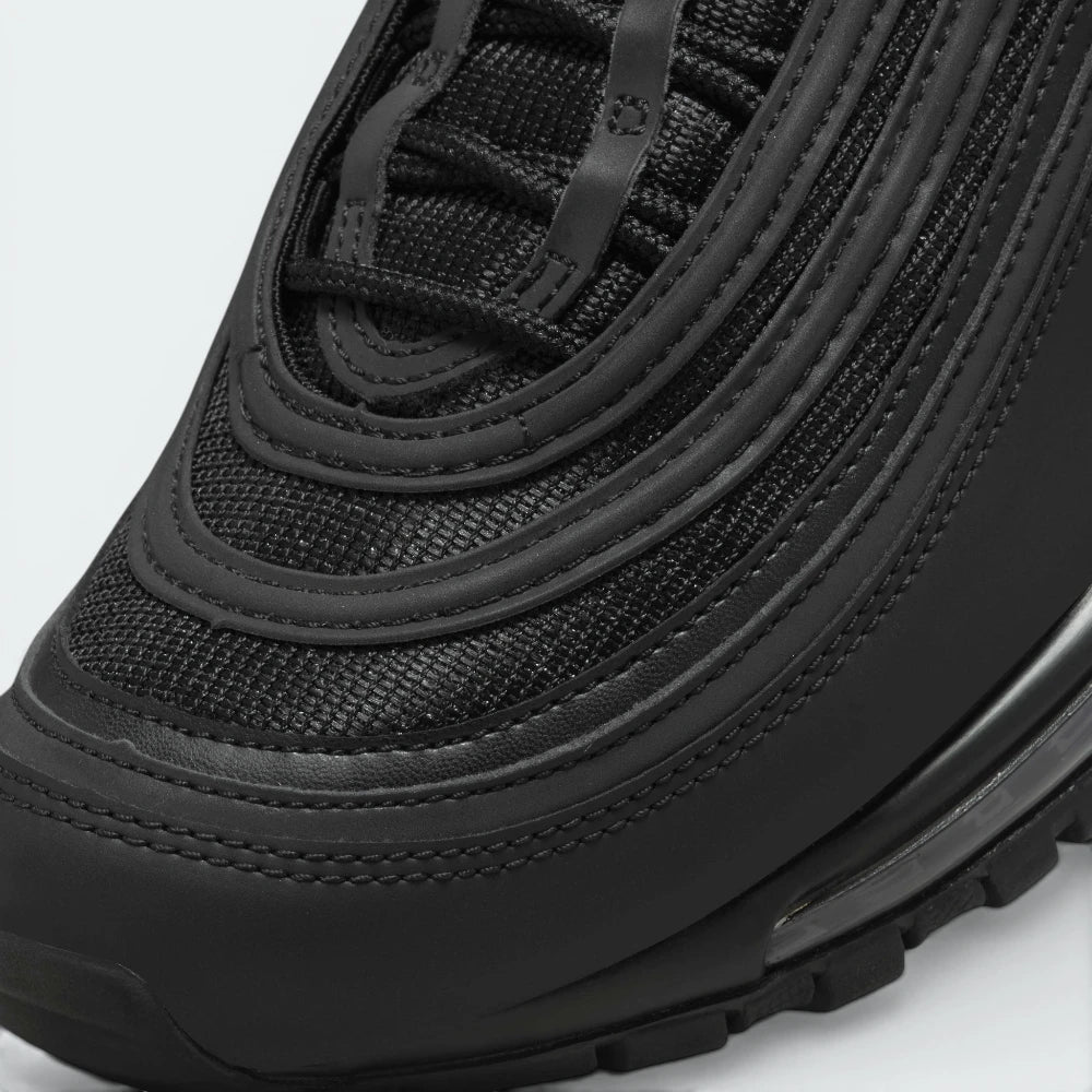 Details the premium reinforcement lines wrapping the front toe scuff guard and the precision hidden lace eyelet entrances.