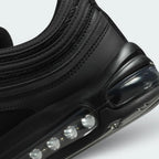 Highlights the "unreal" clean finish where the upper black synthetic mudguard seamlessly bonds onto the top edge of the white cushioning wall.