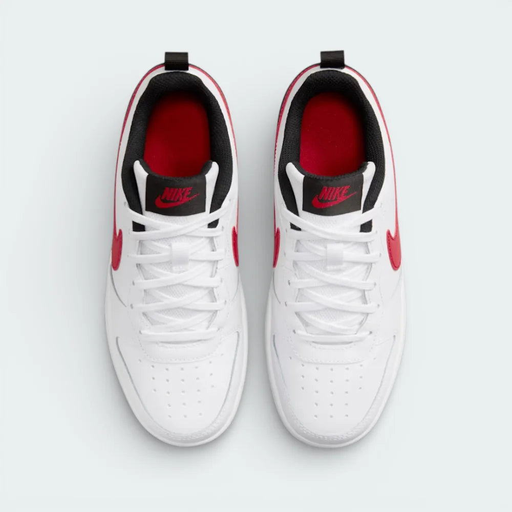 Top-down view of the trainers, highlighting the perforated white toe box and the contrasting black and red Nike branding on the tongue.