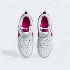 Top-down view of a pair of Nike Court Borough Low 2 Girls' trainers in off-white and pink, highlighting the lace-up closure and perforated toe box.