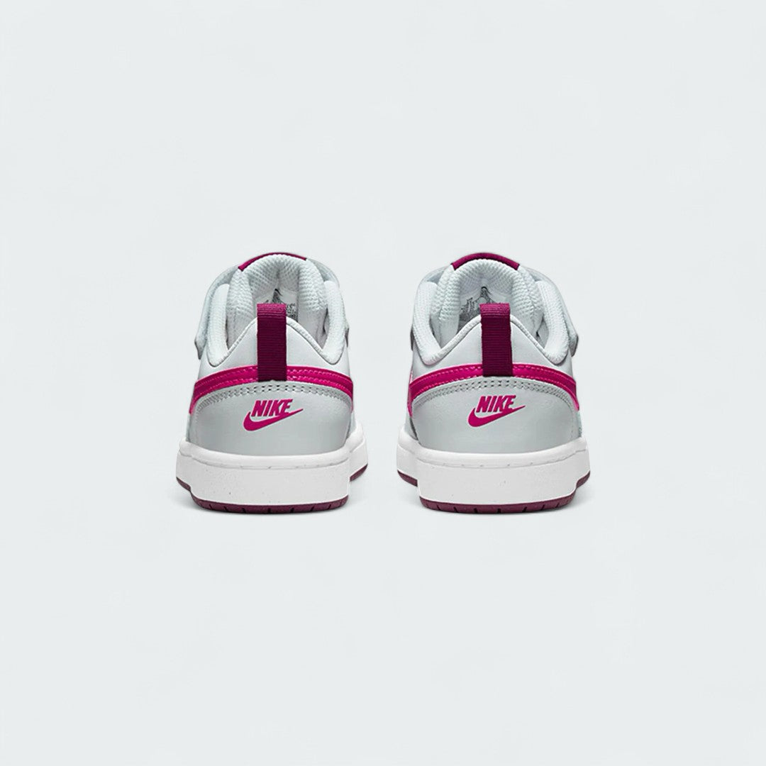 Rear view of the Nike Court Borough Low 2 Girls' trainers, focusing on the heel panel and Nike branding.