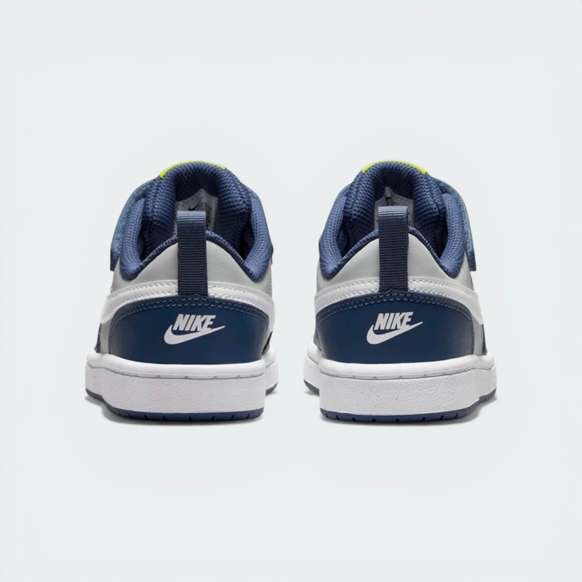 Focusing on the "NIKE" embossed heel branding and the structured support of the rear collar.