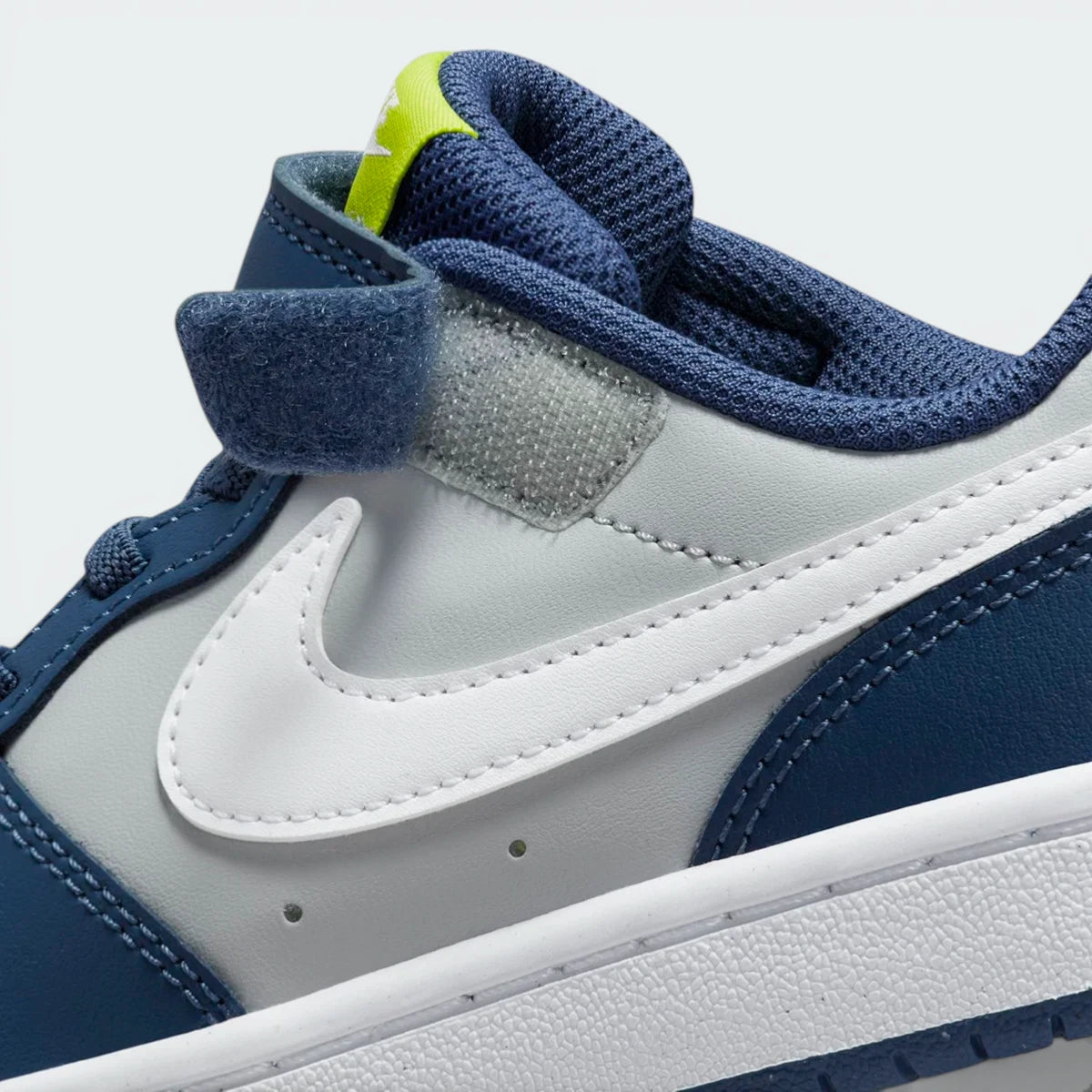 Highlighting the transition between the stitched cupsole and the high-grip rubber tread.