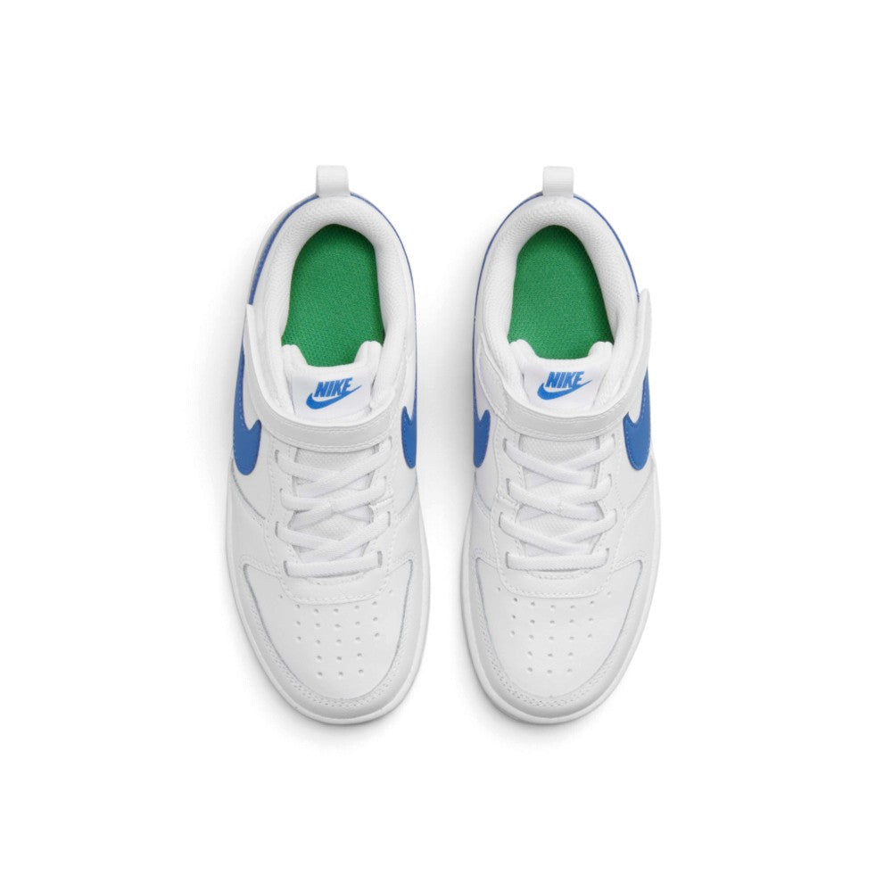Overhead view of both children's sneakers showing the elastic laces, hook-and-loop straps, perforated toe boxes, and green interior sockliners.