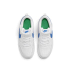 Overhead view of both children's sneakers showing the elastic laces, hook-and-loop straps, perforated toe boxes, and green interior sockliners.
