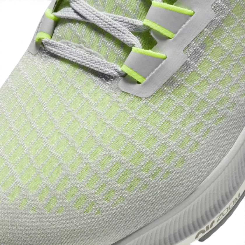 Close-up zoom on the front of the Nike Air Zoom Pegasus 37 Men's grey running trainers, showing the breathable engineered mesh texture and integrated lacing system with Flywire cables.