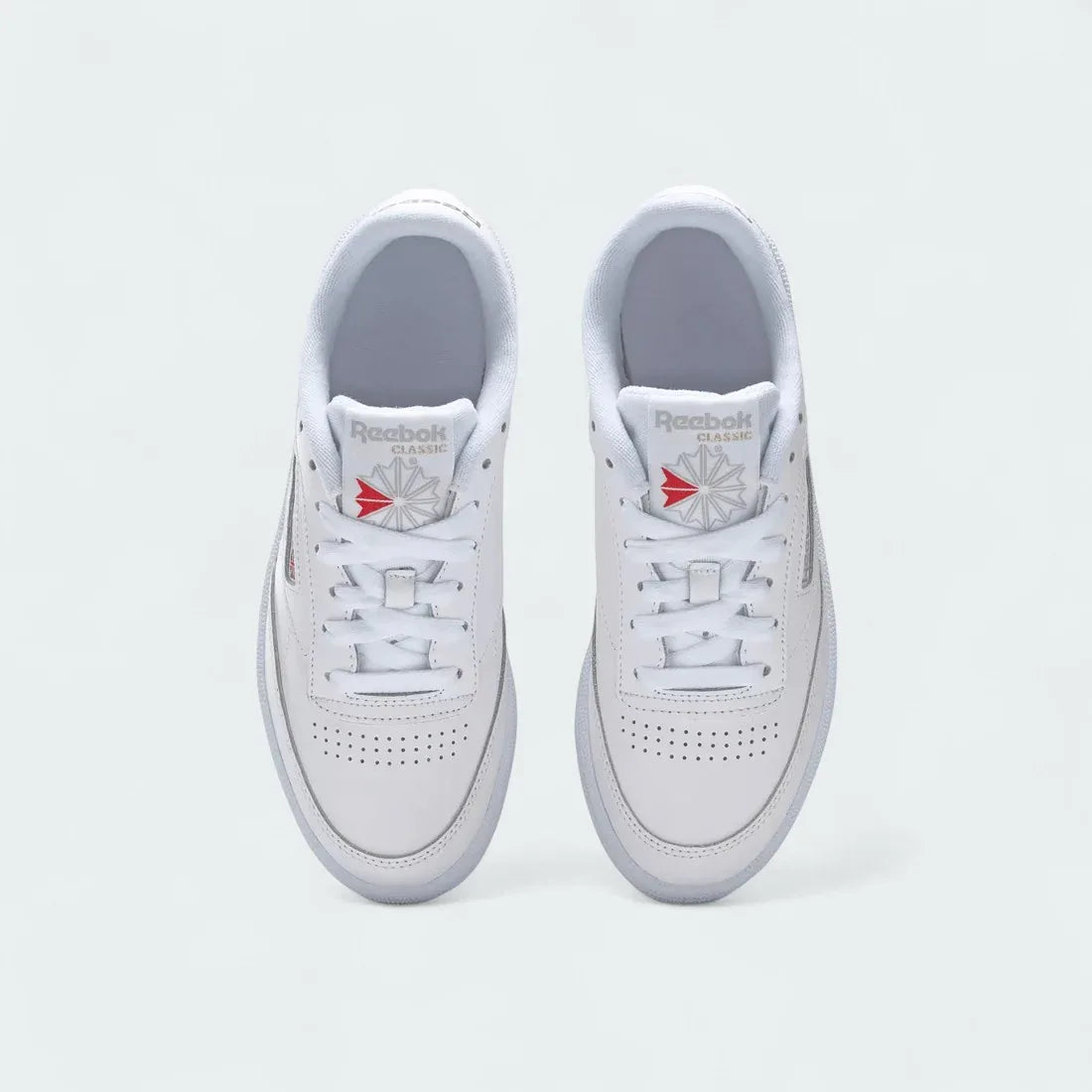 Reebok Club C 85 Women's White Leather Trainers BS7686 top view showing lace-up design, perforated toe box, and branded tongue