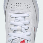 Close-up of Reebok Club C 85 Women's White Leather Trainers BS7686 smooth leather texture, stitching detail, and tongue label