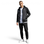 Trade Sports model wearing a black Nike NSW Optic fleece tracksuit with a full-zip hoodie and tapered joggers.