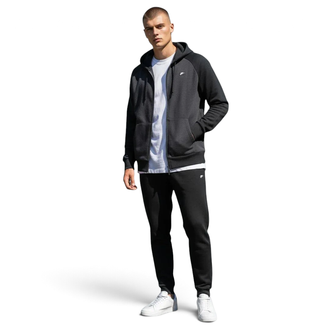 Trade Sports model wearing a black Nike NSW Optic fleece tracksuit with a full-zip hoodie and tapered joggers.