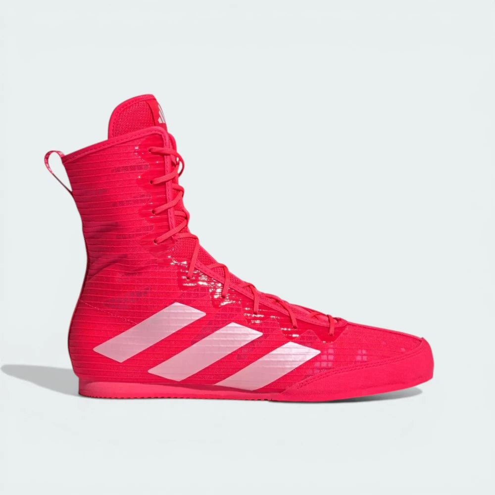 Side profile of the Lucid Red Adidas Box Hog, showing the mid-cut silhouette and the Zero Metallic silver Three Stripes.