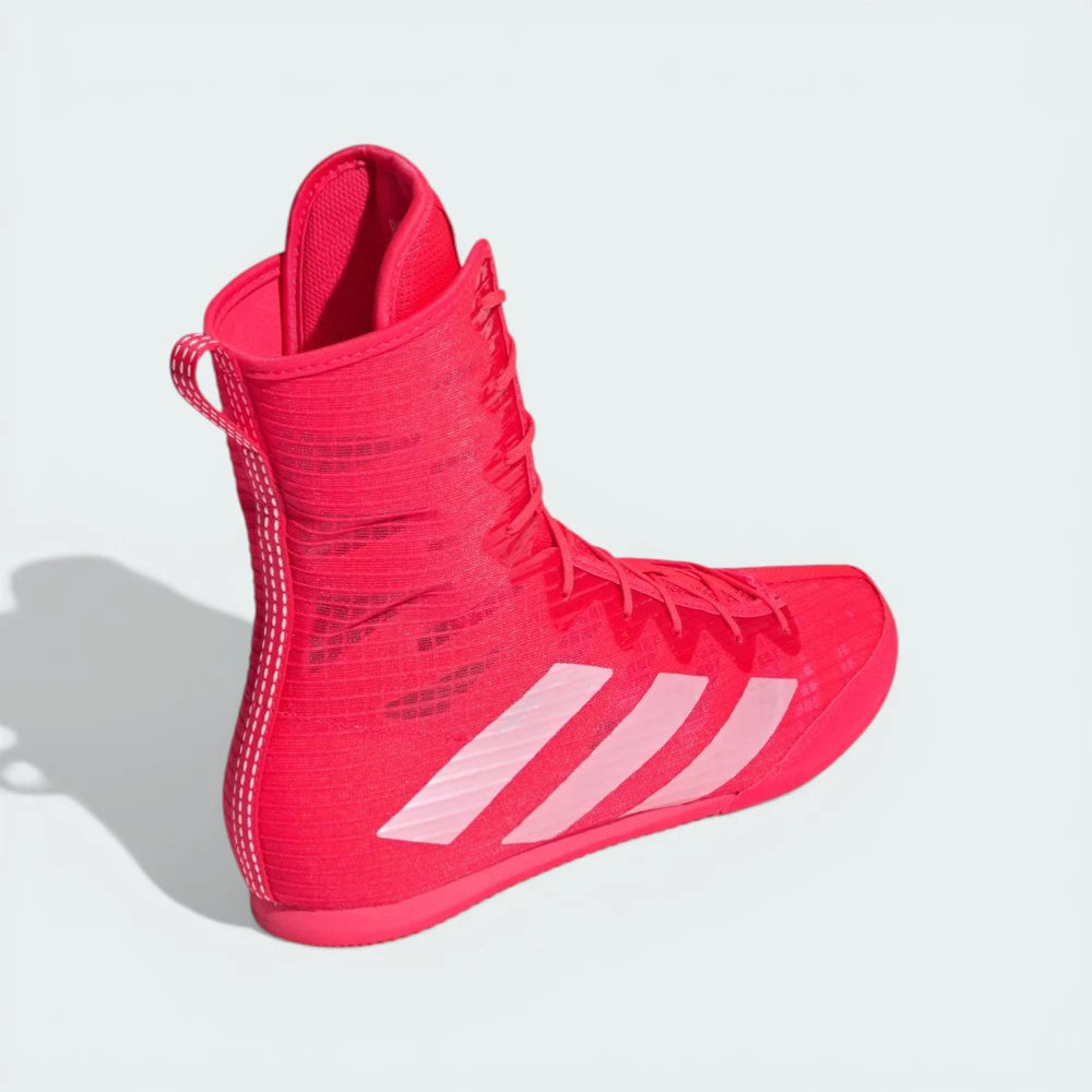 Rear view of the boots, focusing on the structured heel support and the vibrant Lucid Red finish.