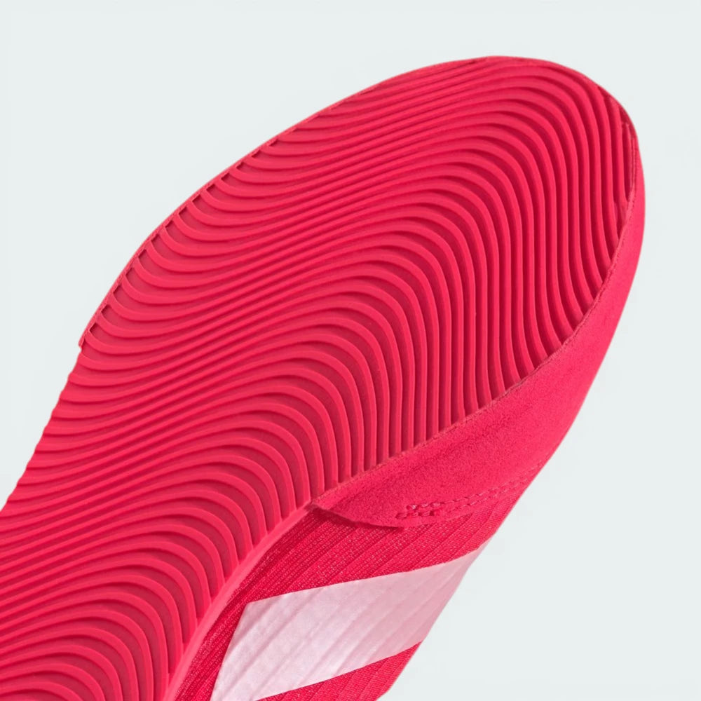 Close-up of a red shoe sole on a light gray background