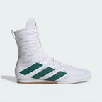Side profile of the Cloud White and Collegiate Green Adidas Box Hog, showing the mid-cut silhouette and the vibrant green Three Stripes.
