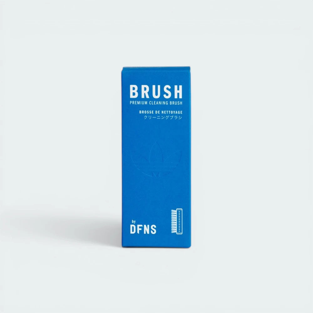 Blue box of a premium cleaning brush with 'DFNS' branding on a white background
