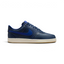 Side profile of the Nike Court Vision Low in Midnight Navy, showing the tonal leather panels and the clean Deep Royal Blue Swoosh.